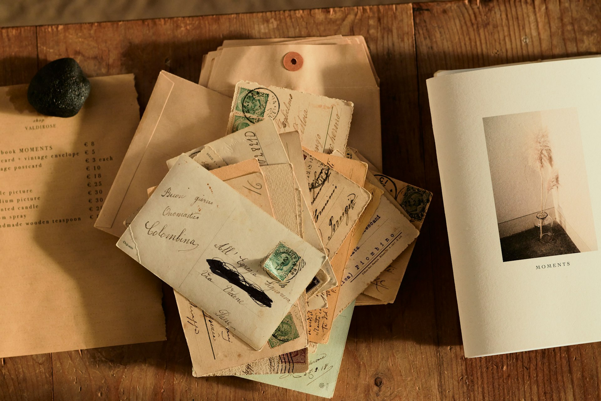 Vintage handwritten letter on wooden desk with soft warm lighting and family photos in background